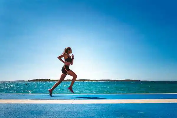 Woman running showing strong leg muscle Amersham